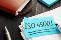 ISO 45001 handwritten on the piece of paper Royalty Free Stock Photo