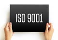 ISO 9001 - international standard that specifies requirements for a quality management system, text concept on card