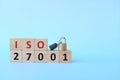 ISO 27001 on wooden blocks with padlock. Information security management system concept. Royalty Free Stock Photo