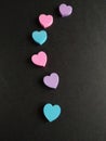 Isokated colorfuk hearts on black background