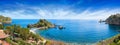 Isola Bella, small island near Taormina surrounded by azure waters of Ionian Sea, Sicily, Italy. Narrow path connects island to Royalty Free Stock Photo