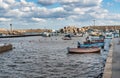 The port of Isola delle Femmine or Island of Women with fishing boats and fishermen at work, province of Palermo, Sicily, Italy Royalty Free Stock Photo