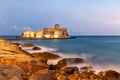 Isola di Capo Rizzuto. Calabria Italy. The Aragon castle at Le Castella at dusk Royalty Free Stock Photo