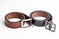 Isolate black and brown leather belt on white background Royalty Free Stock Photo