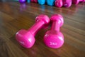 Isolate dumbbell on wooden background .