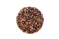 Isolate of unpeeled whole buckwheat seeds in the shape of a circle. Pseudocereal agricultural crop. Royalty Free Stock Photo