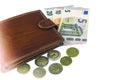 Isolate on white. EU cash. Banknotes of 5, 10, 20 euros. Some coins. Man`s brown wallet Royalty Free Stock Photo