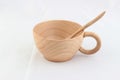 Isolate wooden cup with spoon inside on white background Royalty Free Stock Photo