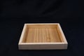 Isolate wooden tray with edge on black back ground.