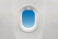 Isolated airplane window with blue sky Royalty Free Stock Photo