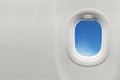 Isolated airplane window with blue sky Royalty Free Stock Photo