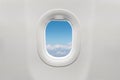 Isolated airplane window with blue sky Royalty Free Stock Photo