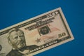 Isolated american fifty dollar bill on blue background Royalty Free Stock Photo