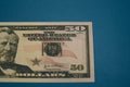 Isolated american fifty dollar bill on blue background Royalty Free Stock Photo