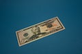 Isolated american fifty dollar bill on blue background Royalty Free Stock Photo