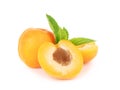 Isolated apricots. Fresh whole apricot fruit with leaf and half isolated on white background with clipping path