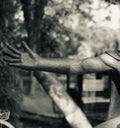 Isolated artificial black concrete hands of a statue