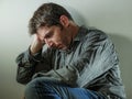 Isolated background portrait of 30s to 40s sad and depressed man looking thoughtful and worried suffering depression problem with Royalty Free Stock Photo