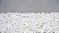 Isolated background of the white big pebbles and a wall Royalty Free Stock Photo