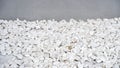 Isolated background of the white big pebbles and a wall Royalty Free Stock Photo