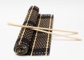 Isolated bamboo mat with chopsticks