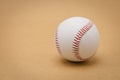 baseball on a brown background and red stitching baseball. White baseball with red thread.Baseball is a national sport of Royalty Free Stock Photo