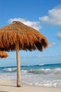 Isolated beach umbrella with blue ocean and sky