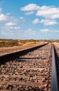 Isolated Beauty: Sunlit Train Tracks in Guajira\'s Desert Landscape Royalty Free Stock Photo