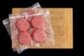 Isolated beef burger patties prepared for freezing