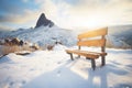 isolated bench on snowy mountain path Royalty Free Stock Photo