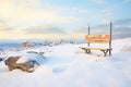 isolated bench on snowy mountain path Royalty Free Stock Photo