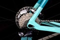 bicycle rear wheel with gearshift chainrings and black spokes. white metal frame. macro view. Royalty Free Stock Photo