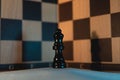 Isolated black queen chess piece with checkered background Royalty Free Stock Photo