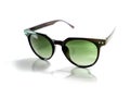 Isolated black sunglasses with green lens