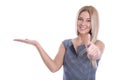 Isolated blond smiling businesswoman is presenting and thumb up.