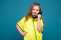 Pretty, little girl in tee shirt with brown hair hold phone Royalty Free Stock Photo