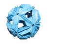 Isolated blue paper origami kusudama shape of sphere with shadow on white background