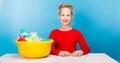 Adorable girl with a basin full of cleaners Royalty Free Stock Photo