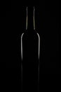 Isolated bordeaux wine bottle, dark background silhouette