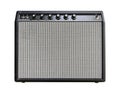 Isolated boutique black leather vintage electric guitar amplifier with a black knob on white background with clipping path. Royalty Free Stock Photo