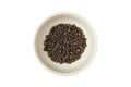 Isolated bowl of black dried pepper