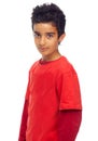 Isolated boy child, studio portrait and fashion with red t-shirt, confident and cool by white background. Male indian Royalty Free Stock Photo