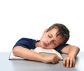 Isolated boy dreaming over thick book