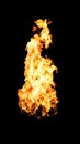 Isolated Bright and Intense Tall Orange Flame without Smoke on Black Royalty Free Stock Photo
