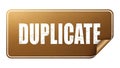 Isolated brown sign with the word duplicate in white font, showing texture detail Royalty Free Stock Photo