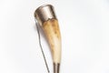 Isolated Caucasian wine drinking horn. Caucasian horn with decorative metal elements