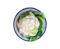 Isolated cauliflower in a bowl with water drops on a white background