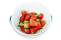 Isolated cleaning strawberries in the white enamel strainer