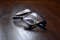 Isolated Close-up Glasses on brown table