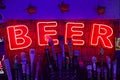 Illuminated red BEER sign